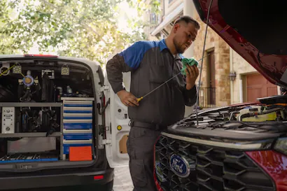 Ford mobile expert inspecting vehicle